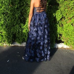 This is a used navy blue prom dress